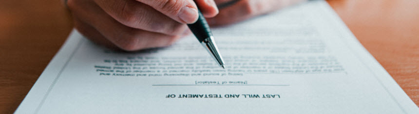 man signing last will and testament